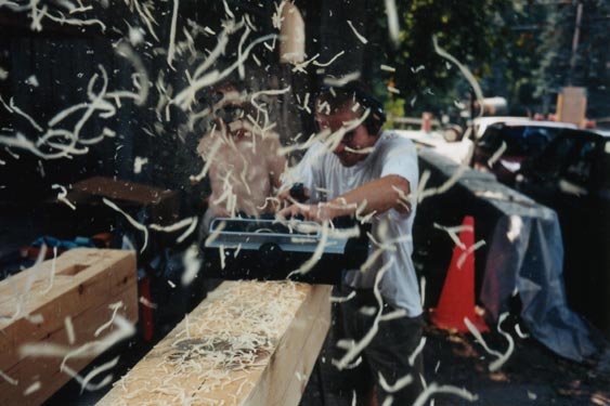 Planing a timber with chips flying